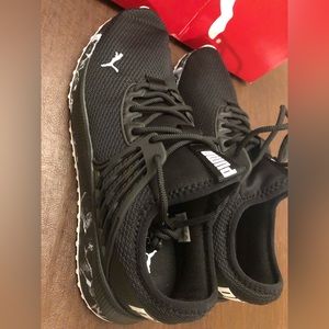 Size 11 Puma Sneakers- Black and White with Soft Foam for optimal comfort